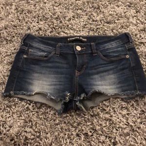 Dark wash denim shorts from Express